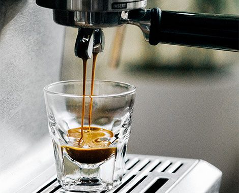 A photo of our machine pouring a double shot of coffee
